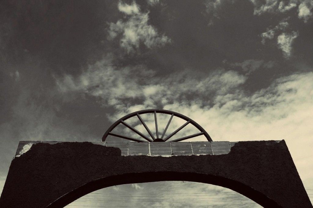 image 1 - Entrance to Suto Orizari or Shutka municipality, Republic of Macedonia. Shutka is a home to 50 000 Roma people, and the only place in Europe with Romani as its official language. Spoked wheel is a symbol of Roma people and it is also on their flag.