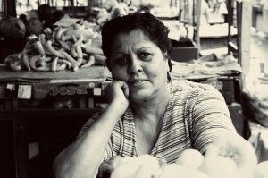 image6-Morning at Shutka's market. Lady selling vegetables . Fresh fruits and vegetables are sold here daily, and people love to work here, they're happy to have a job.