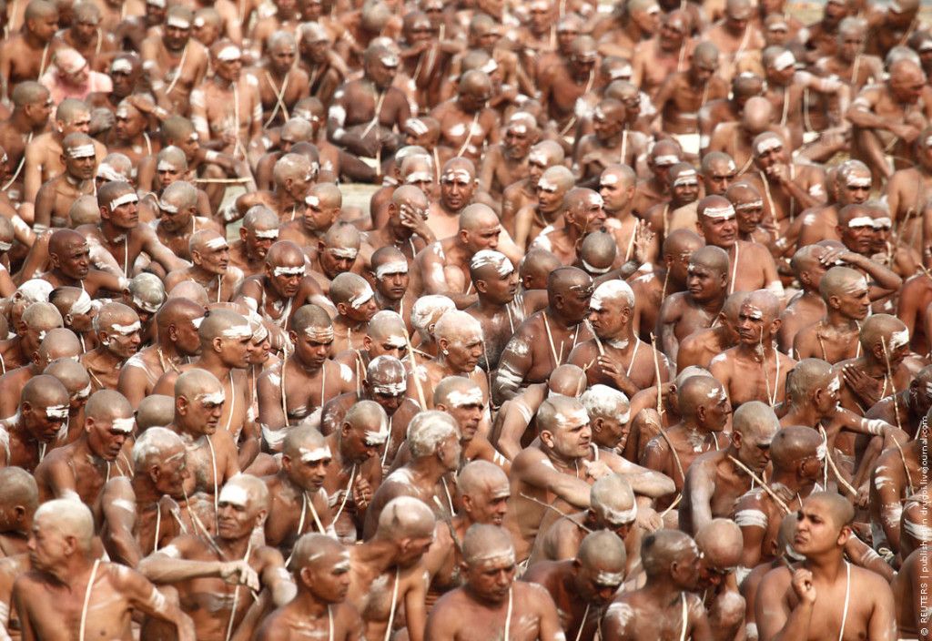 Newly initiated Naga Sadhus of the Juna Akhara attend the Dikasha ritual on the banks of the river Ganges during the ongoing Pitcher Festival in Allahabad
