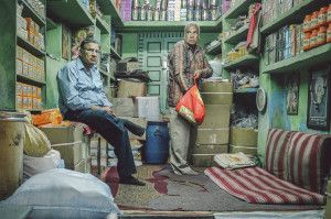 Shop owner with customer