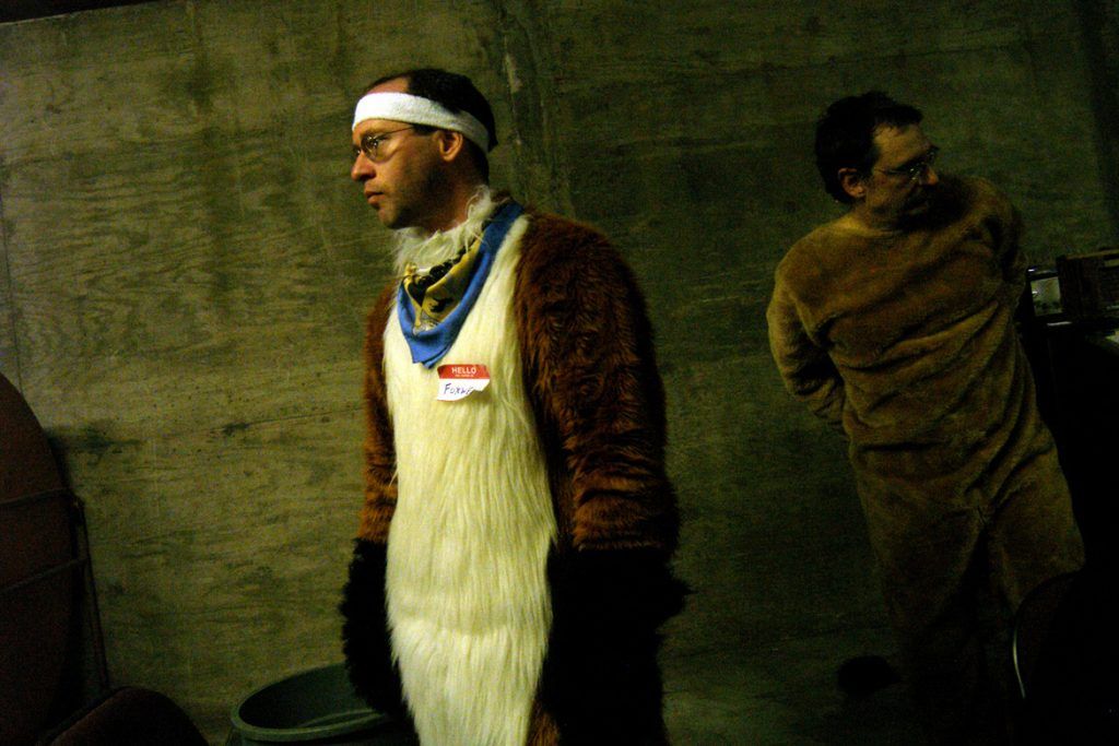 Foxwell Foxcoon (center) and Lowen Kind wait in the basement of the civic center in Poughkeepsie, New York, after marching in the Kid's Expo parade. Furries are a group of people who identify themselves not as being human but as a walking, talking animal. For some the lifestyle is complete, animal traits reach into every aspect of life from mundane trips to a grocery store to sexual fantasies. For others, involvement in the furry fandom is limited to public performances and meet-and-greets.