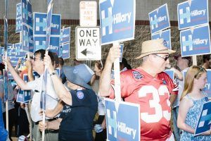 Supporters of Democratic presidential candidate Hillary Clinton get ready to march in the Labor Day parade in Milford, New Hampshire. Though Clinton did not march in the parade, Republican candidates John Kasich, Carly Fiorina, and Lindsey Graham, and Democratic candidate Bernie Sanders did march in the parade.