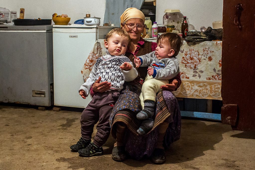 Mrs. Radmila Simic is holding her two grandsons, Stefan and Aleksa, in an old house of family Simic in Serbian enclave Velika Hoca. They were born in mixed marriage between Kosovo Serb Krsta Simic and his wife Pranvera who is Albanian. Pranvera came to Velika Hoca few years ago, when Krsta went to Albania to propose on her. They live today in harmonious marriage despite all the differences, although from time to time they feel like they are discriminated by the community.