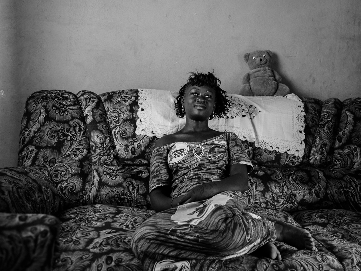 Sevare, Mali; Just down the street from the club´s office, Fatoumata poses in the familiy´s livingroom